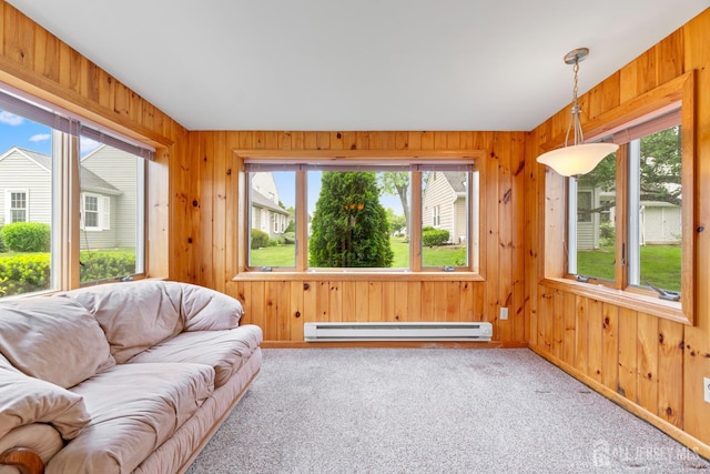 104 Glenwood Ln Unit A, Monroe, NJ 08831 - living area featuring a baseboard heating unit, plenty of natural light, carpet flooring, wooden walls, and baseboards