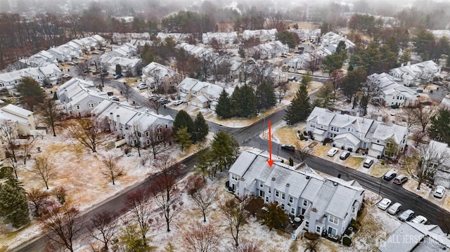 birds eye view of property with a residential view