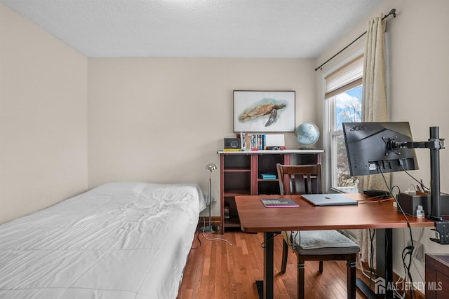 bedroom featuring hardwood / wood-style floors