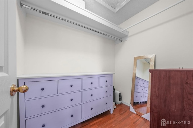 spacious closet with wood finished floors