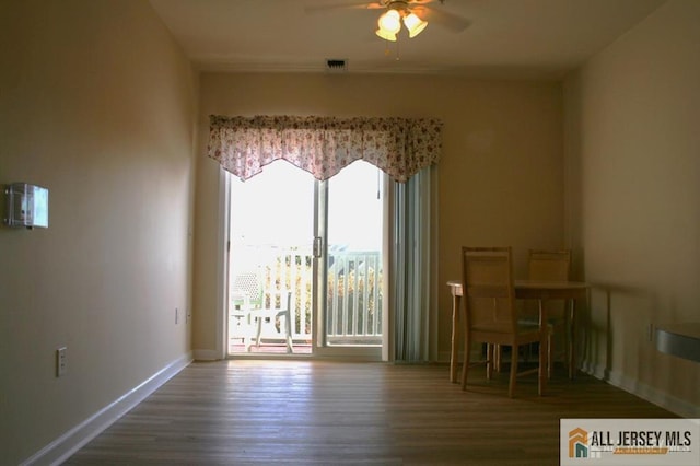 100 John T O Leary Blvd Unit 311, South Amboy, NJ 08879 - dining room with a ceiling fan, wood finished floors, and baseboards