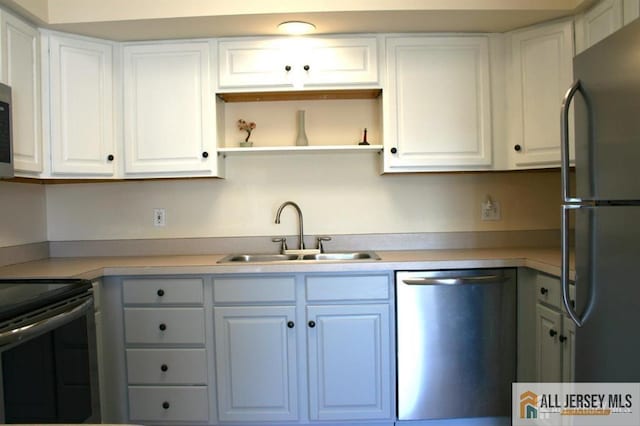 100 John T O Leary Blvd Unit 311, South Amboy, NJ 08879 - kitchen featuring stainless steel appliances, a sink, light countertops, and white cabinets