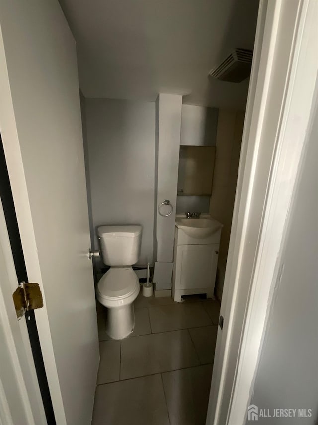 79 W 18th St, Bayonne, NJ 07002 - bathroom featuring tile patterned floors and vanity