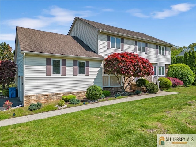 view of front of home with a front yard