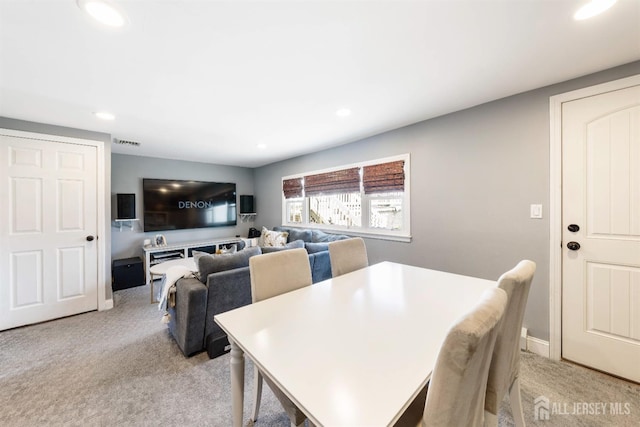 dining area featuring recessed lighting, baseboards, light colored carpet, and visible vents
