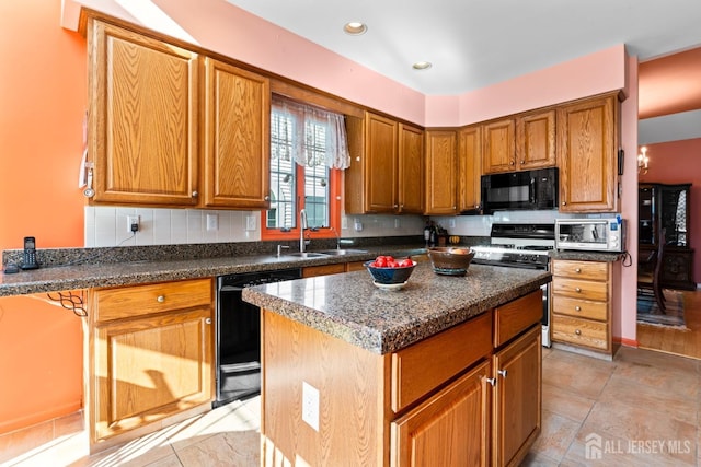 kitchen featuring a center island, backsplash, brown cabinetry, a sink, and black appliances