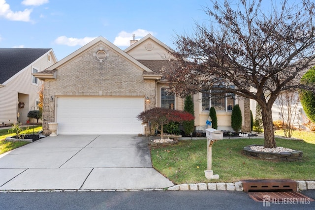 view of front of home with brick siding, a chimney, a front yard, a garage, and driveway