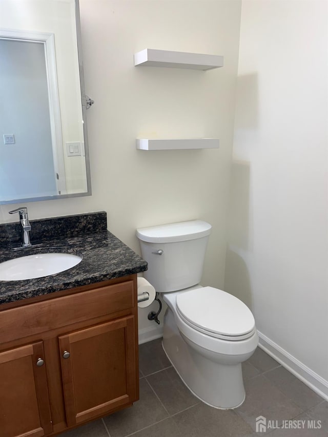 1425 Hudson Cir, Highland Park, NJ 08904 - bathroom with tile patterned floors, toilet, vanity, and baseboards