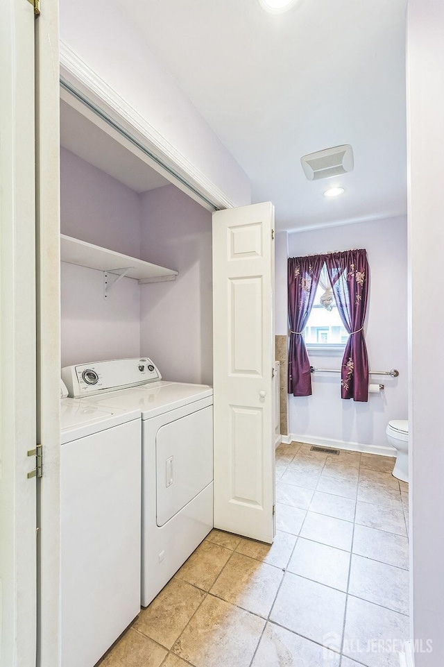 55 Leland Ave, Plainfield, NJ 07062 - washroom featuring washer and dryer and light tile patterned floors