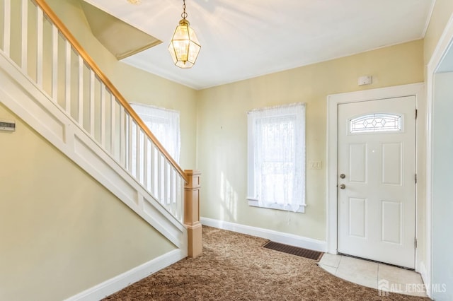 55 Leland Ave, Plainfield, NJ 07062 - carpeted foyer entrance with stairway and a chandelier
