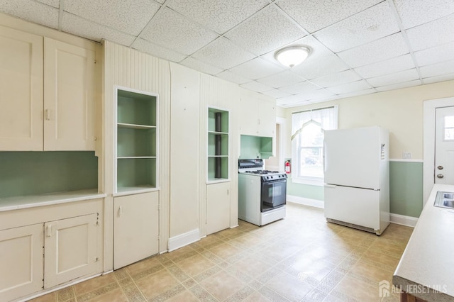 55 Leland Ave, Plainfield, NJ 07062 - kitchen featuring white appliances, light countertops, and a paneled ceiling