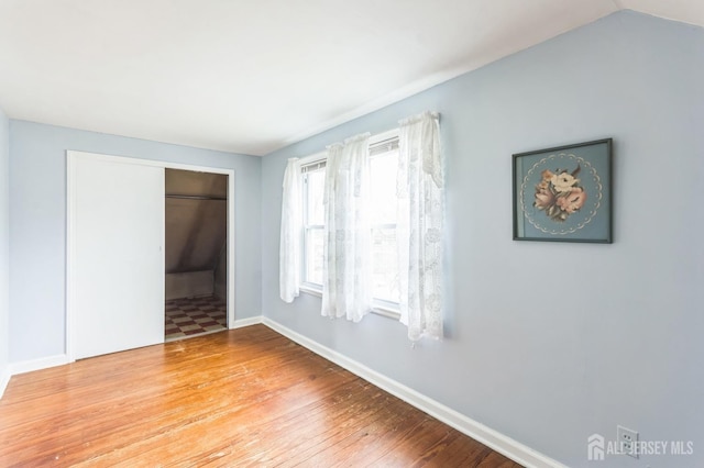55 Leland Ave, Plainfield, NJ 07062 - unfurnished bedroom with hardwood / wood-style floors and baseboards
