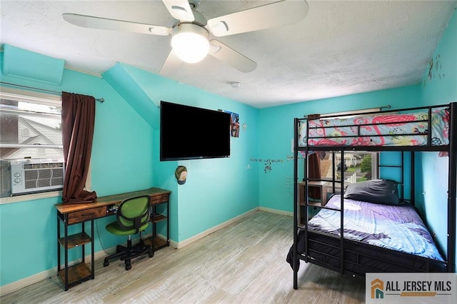 53 Second St, Edison, NJ 08837 - bedroom with wood finished floors, cooling unit, a textured ceiling, and ceiling fan