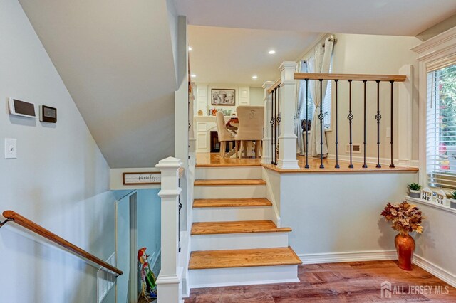 stairway featuring hardwood / wood-style flooring