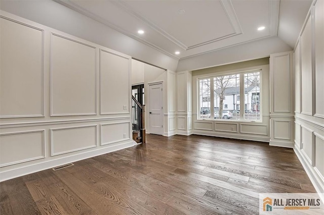 interior space featuring dark hardwood / wood-style flooring and crown molding