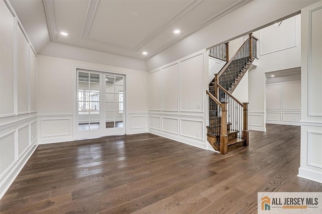 spare room with dark hardwood / wood-style floors and ornamental molding