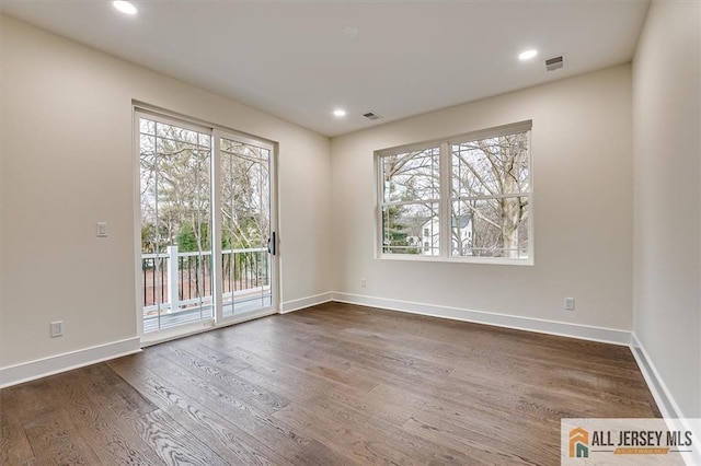 unfurnished room featuring dark hardwood / wood-style floors