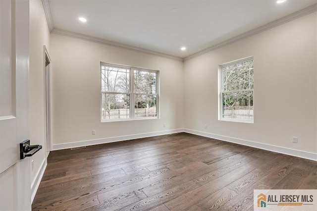 unfurnished room featuring dark wood-type flooring and crown molding