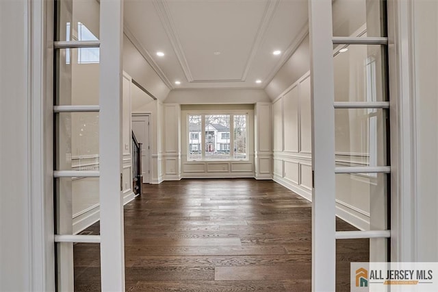 interior space featuring dark hardwood / wood-style flooring and ornamental molding