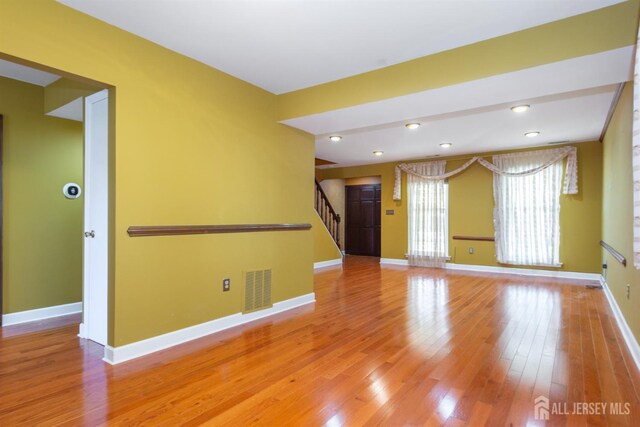 empty room with light hardwood / wood-style floors