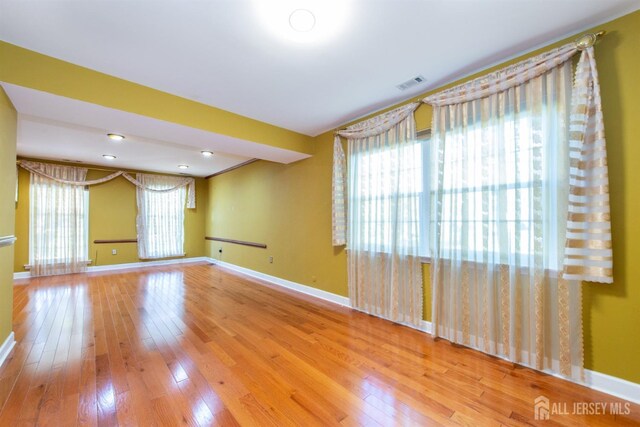 unfurnished room featuring light hardwood / wood-style flooring