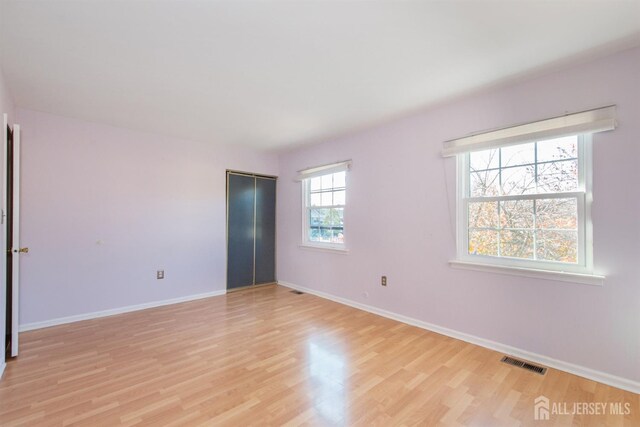 spare room featuring light hardwood / wood-style floors