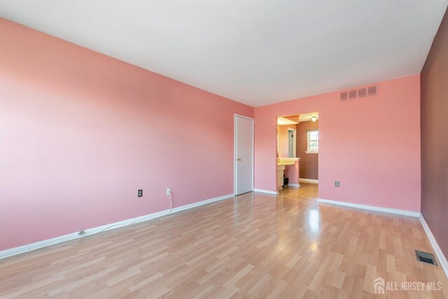 unfurnished room featuring light hardwood / wood-style floors