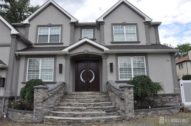 260 Church Ln, North Brunswick, NJ 08902 - view of front of property with stucco siding and entry steps