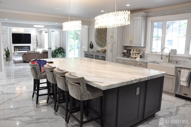 260 Church Ln, North Brunswick, NJ 08902 - kitchen featuring dishwasher, light marble finish flooring, a sink, light stone counters, and a spacious island
