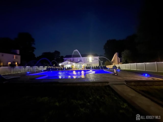 260 Church Ln, North Brunswick, NJ 08902 - pool at night with a patio