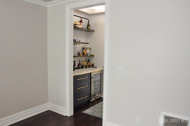 260 Church Ln, North Brunswick, NJ 08902 - indoor dry bar with wine cooler, crown molding, and dark wood-style flooring
