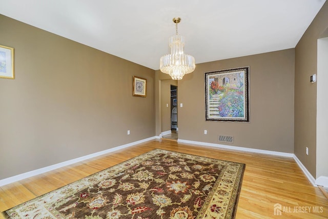 415 Spotswood Englishtown Rd, Monroe, NJ 08831 - dining area featuring a chandelier, light wood finished floors, and baseboards