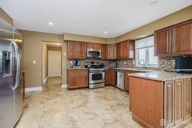 415 Spotswood Englishtown Rd, Monroe, NJ 08831 - kitchen with stainless steel appliances, backsplash, light stone countertops, baseboards, and a sink