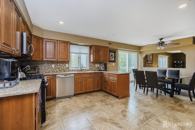 415 Spotswood Englishtown Rd, Monroe, NJ 08831 - kitchen with appliances with stainless steel finishes, healthy amount of natural light, tasteful backsplash, a peninsula, and recessed lighting