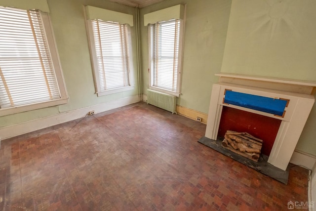 unfurnished living room with radiator