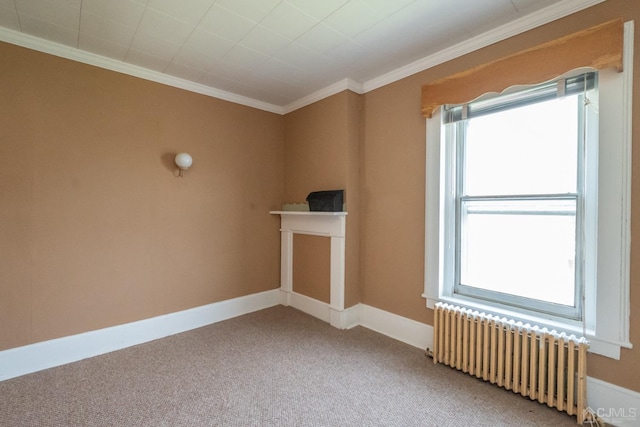 carpeted spare room featuring radiator heating unit and crown molding