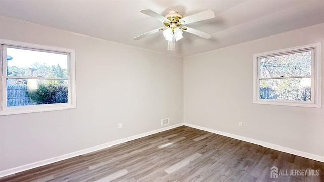 unfurnished room featuring ceiling fan and wood-type flooring