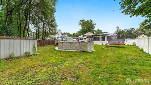 587 Malboro Rd, Old Bridge, NJ 08857 - fenced backyard with a shed, a trampoline, and a gazebo