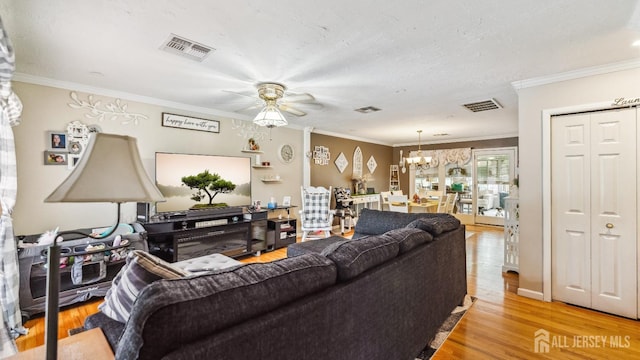 587 Malboro Rd, Old Bridge, NJ 08857 - living room featuring a ceiling fan, light wood-style floors, a chandelier, and ornamental molding