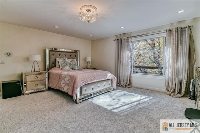 carpeted bedroom featuring baseboards and recessed lighting