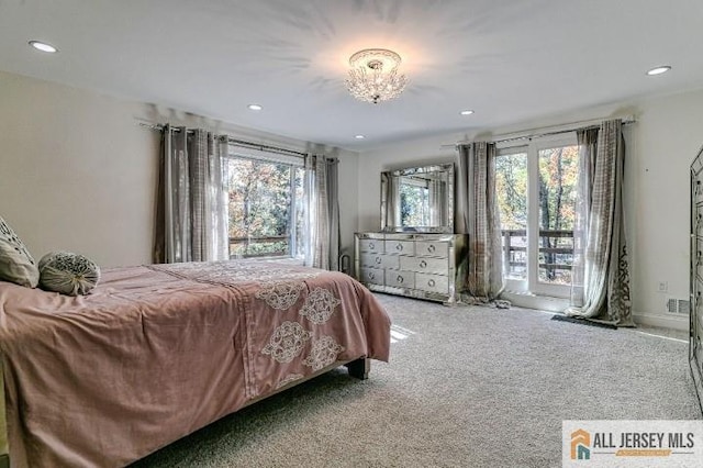 carpeted bedroom with access to exterior, multiple windows, and recessed lighting