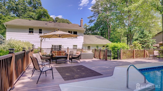 9 Toby Ter, Monroe, NJ 08831 - rear view of house with outdoor lounge area, a deck, and a chimney