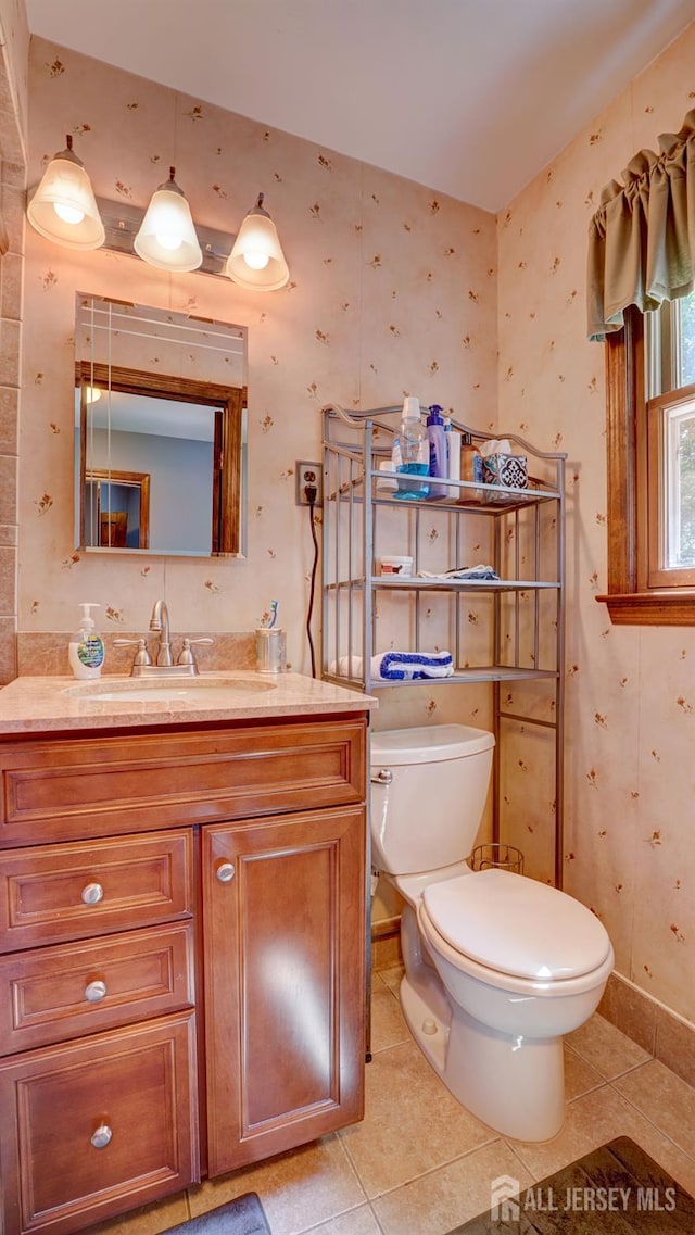 9 Toby Ter, Monroe, NJ 08831 - half bathroom with wallpapered walls, tile patterned floors, toilet, vanity, and baseboards
