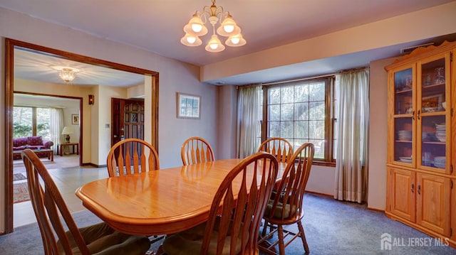9 Toby Ter, Monroe, NJ 08831 - dining space with a chandelier, baseboards, and dark carpet