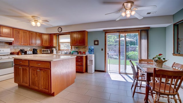 9 Toby Ter, Monroe, NJ 08831 - kitchen with white gas range oven, a ceiling fan, under cabinet range hood, and backsplash