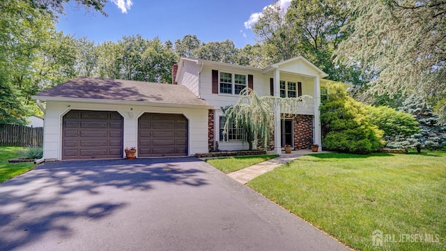 9 Toby Ter, Monroe, NJ 08831 - view of front of house with driveway, an attached garage, a chimney, and a balcony