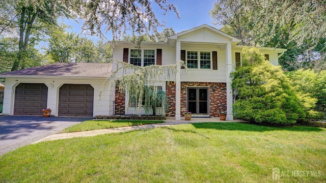 9 Toby Ter, Monroe, NJ 08831 - greek revival inspired property featuring asphalt driveway, an attached garage, a front lawn, and brick siding