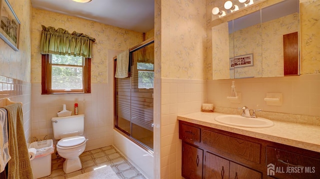 9 Toby Ter, Monroe, NJ 08831 - bathroom featuring tile walls, wallpapered walls, toilet, vanity, and enclosed tub / shower combo