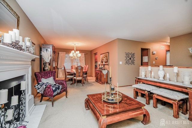 carpeted living room featuring a fireplace with flush hearth and a chandelier