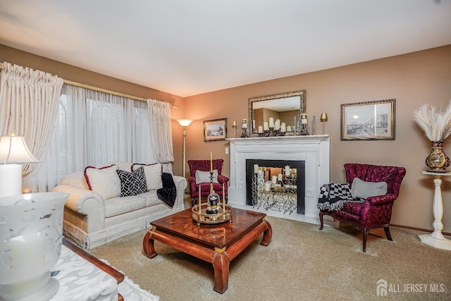 carpeted living area with a fireplace